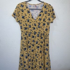Yellow wrap dress with blue flowers